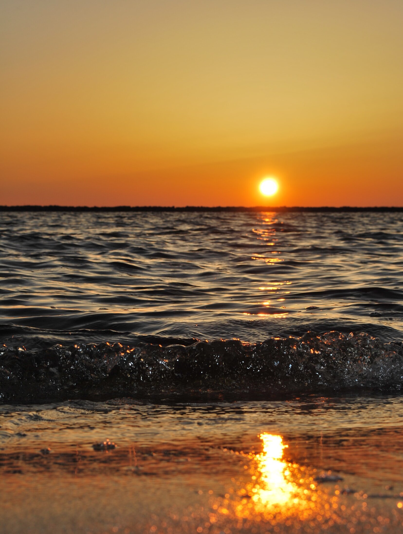 sunset on the water and beach